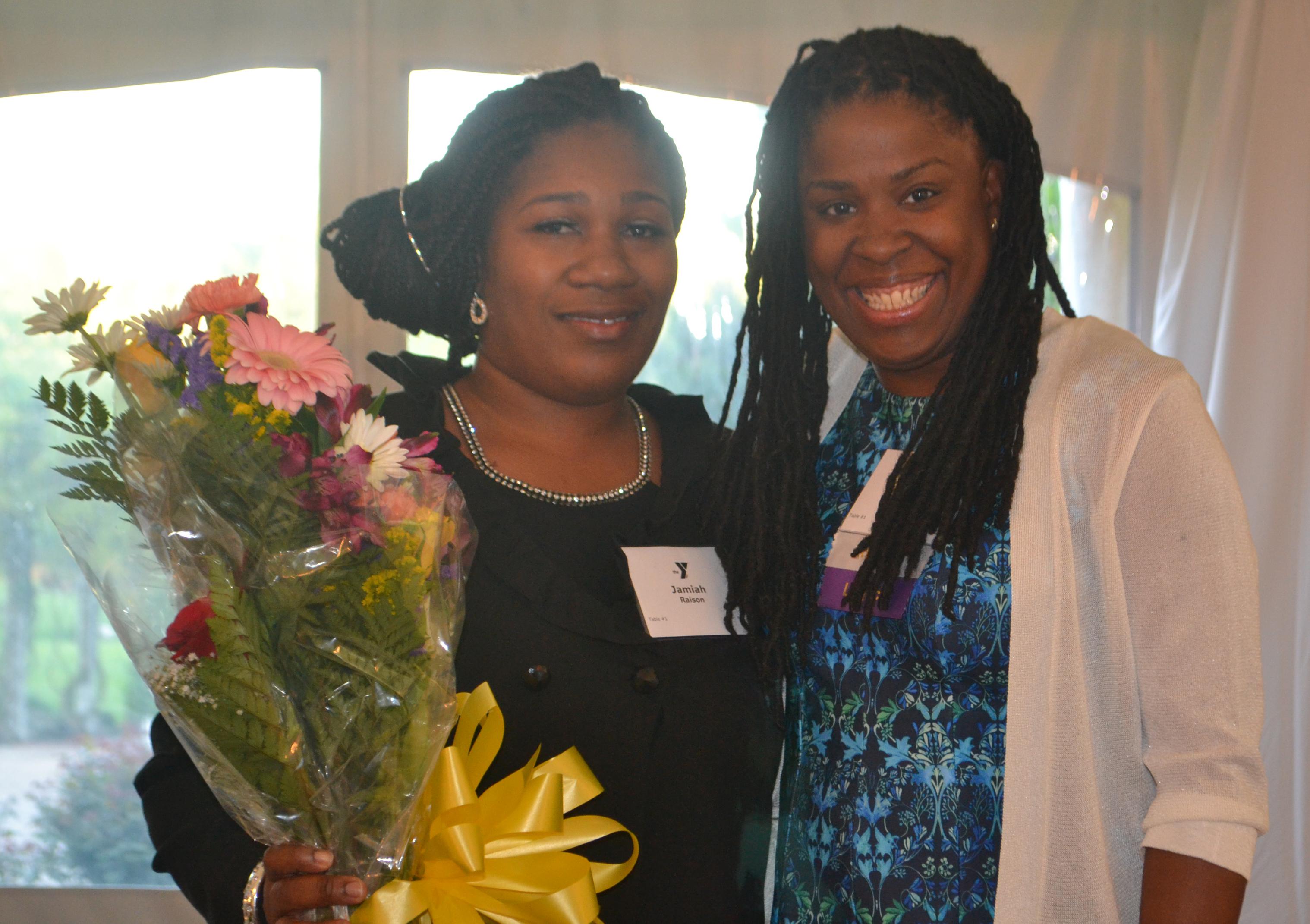 Annual Dinner - Lakeisha Harris poses with a YMCA member who recently benefited from a financial assistance offered by the YMCA.