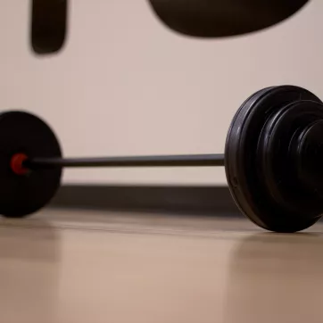 barbell on the floor of an exercise studio