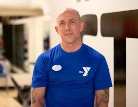 Upper Main Line YMCA personal trainer Steve Fowler poses for a headshot in the gym in Berwyn, PA.