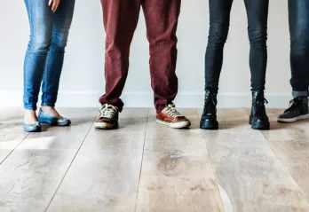 A few teenagers standing. 