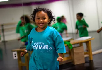 A young girl participates in a dance class during YMCA summer camp at the Upper Main Line YMCA in Berwyn, PA