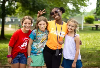 Summer camp counselor with campers at the Coatesville YMCA.