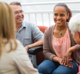 A woman connects with fellow YMCA members during a member event. 