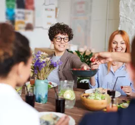 A group of people share a meal during a luncheon event at the YMCA