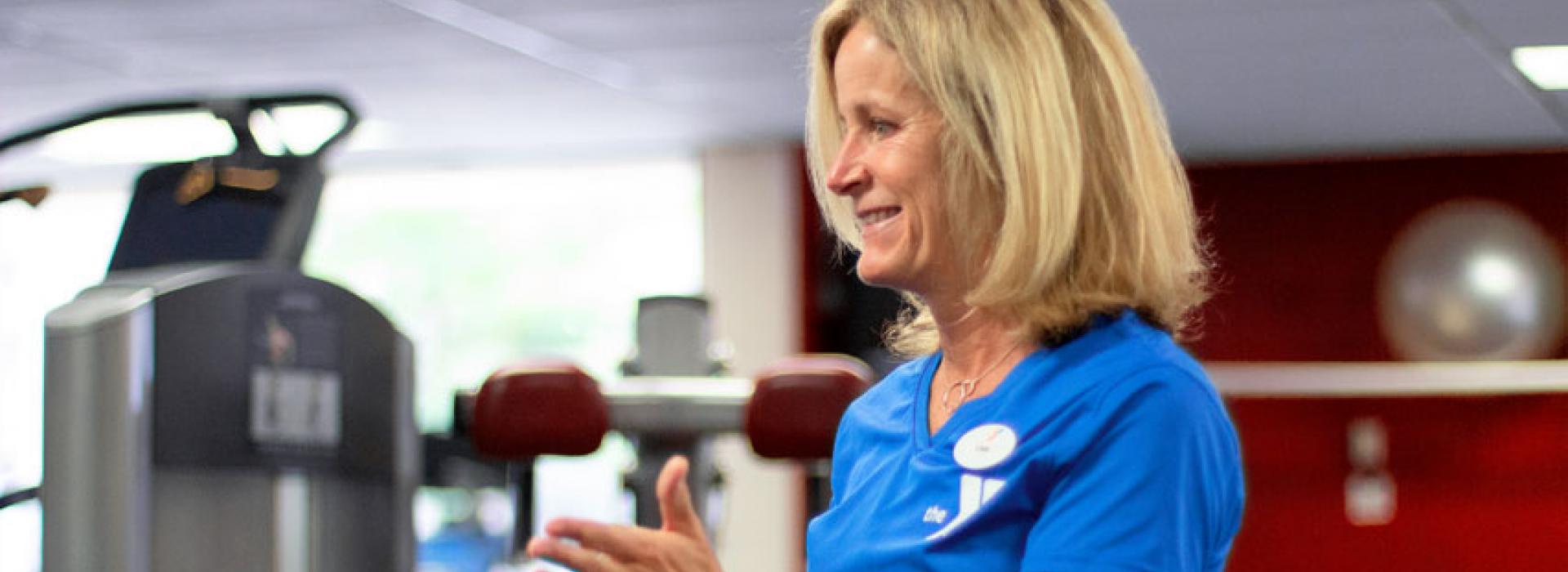 West Chester Area YMCA Personal Trainer Cari Wolfe instructs a client during a training session in the wellness center.