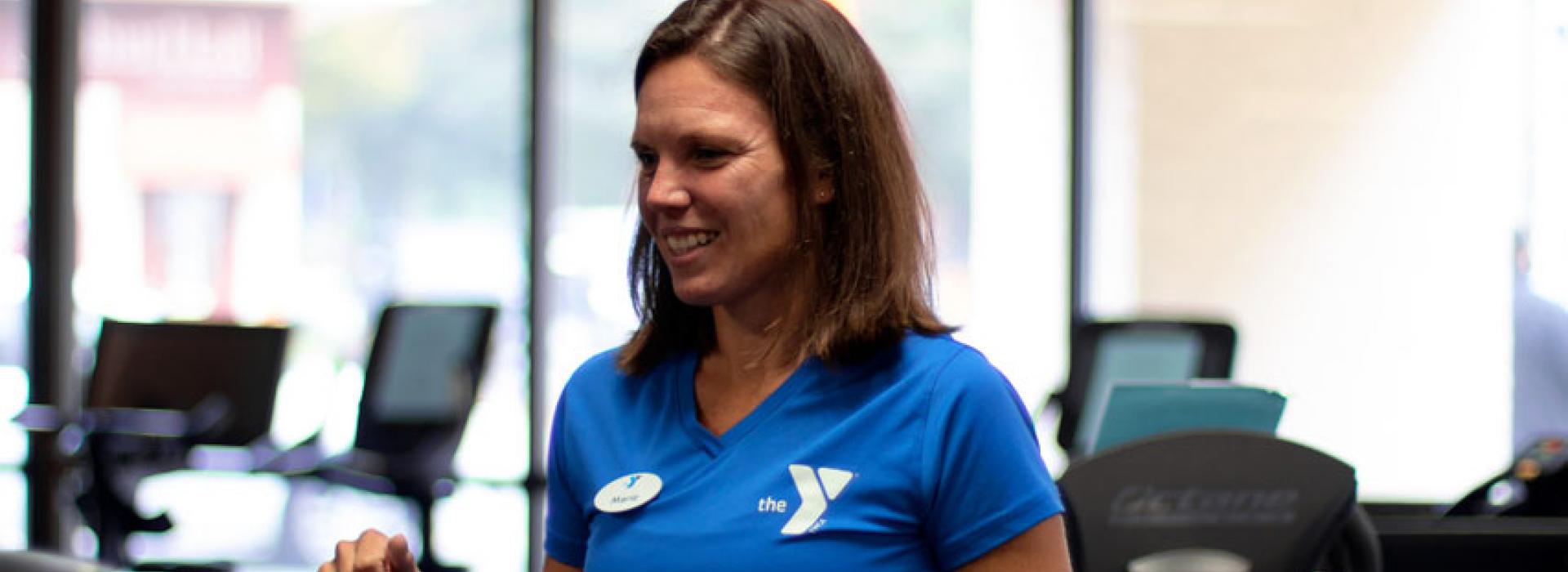 Kennett Area YMCA Personal trainer Marie Pepper speaks with a client at the wellness center in Kennett Square, PA.