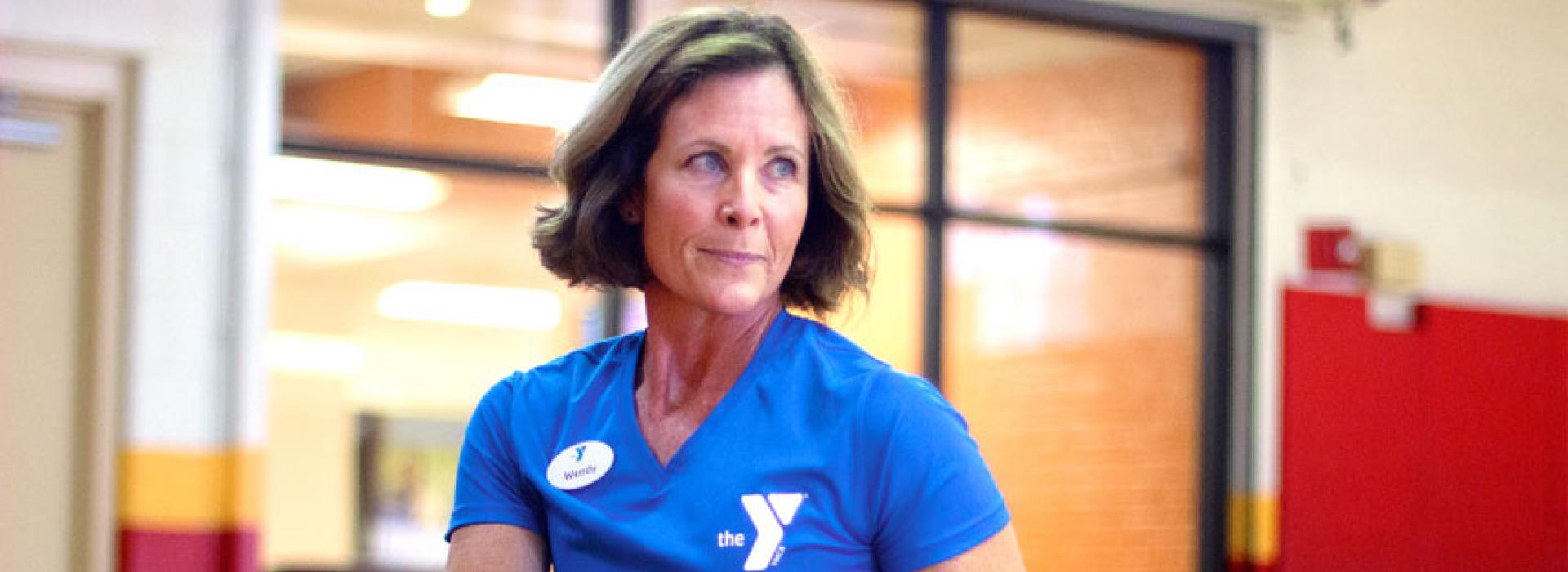 Oscar Lasko YMCA personal trainer Wendy Young demonstrates a workout with a weighted ball in the gym at the Oscar Lasko YMCA in West Chester PA