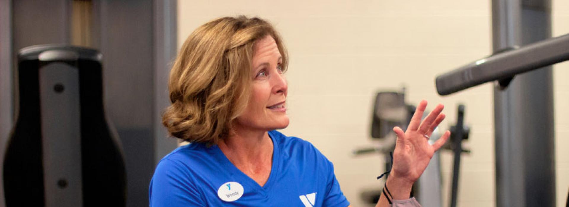 Oscar Lasko YMCA personal trainer Wendy Young instructs a client in the fitness center of the Oscar Lasko YMCA in West Chester PA