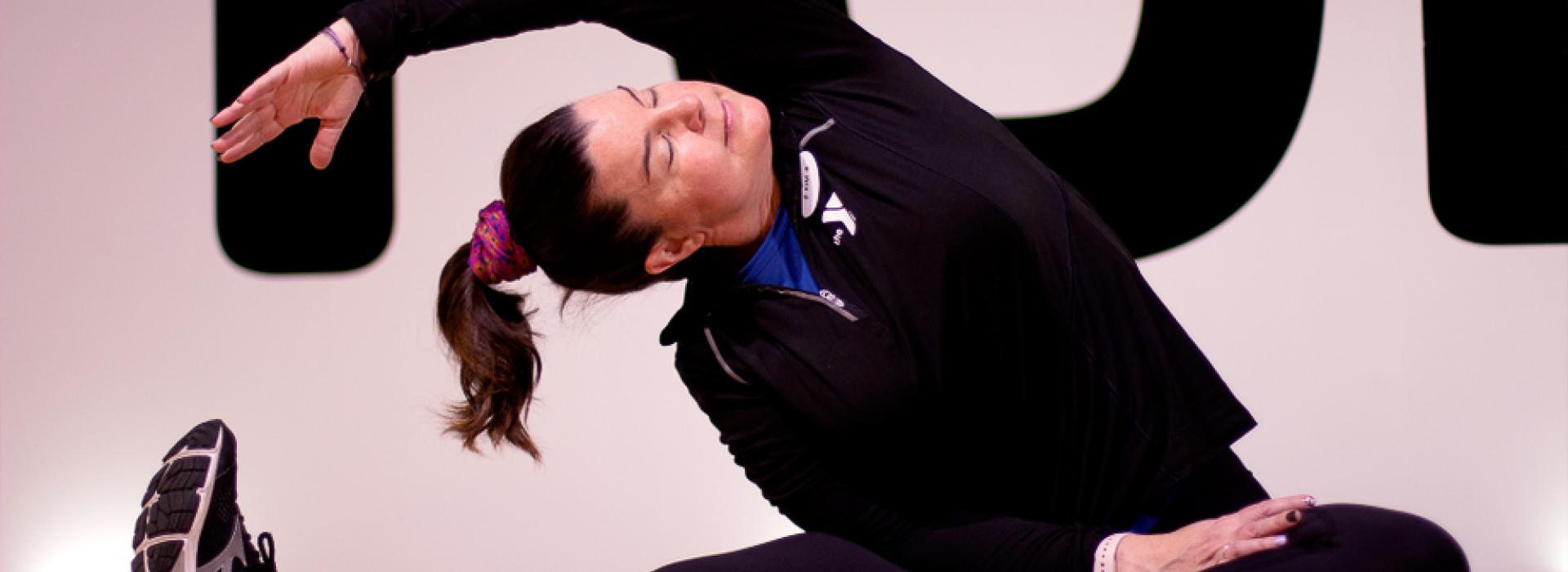 Personal trainer, Kim Petry at the YMCA is showing you how to do a few side bend stretches.