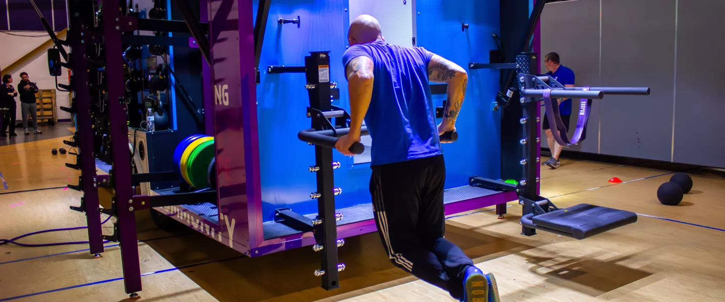 Wellness Director working out on the YMCA of Greater Brandywine mobile fitness truck, YGBW Fit Truk.