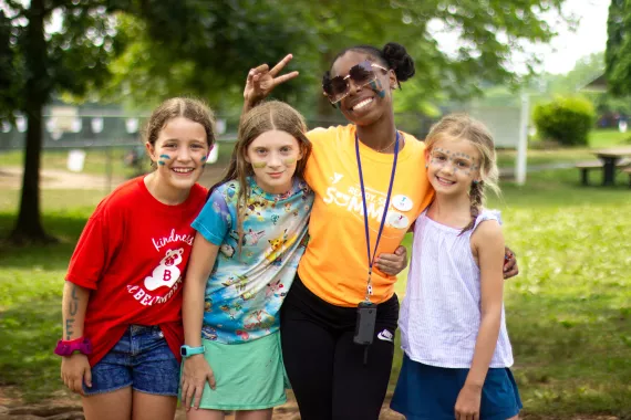 Summer camp counselor with campers at the Coatesville YMCA.