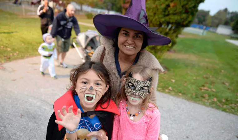 A family poses in their Halloween costumes at a Halloween event at Upper Main Line YMCA in Berwyn, PA
