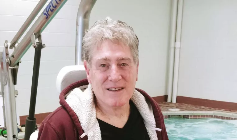 Brandywine YMCA member Dennis Shead sits near the indoor therapy pool. 