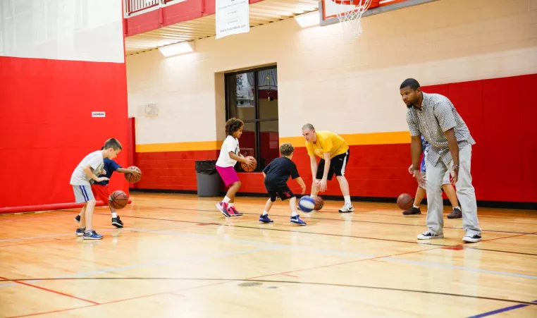 Preschool and elementary school students participate in a YMCA basketball and all sports clinic in the gym at the Oscar Lasko YMCA in West Chester, PA.