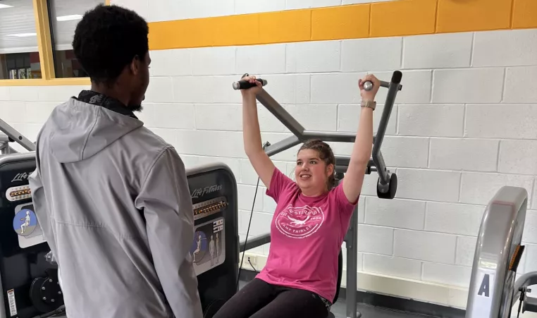 Woman works out with a coach at the Kennett Area YMCA