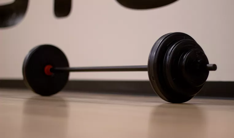barbell on the floor of an exercise studio