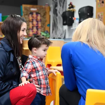 A mother meets with her son's daycare teacher at the Lionville Community YMCA childcare program in exton, pennsylvania
