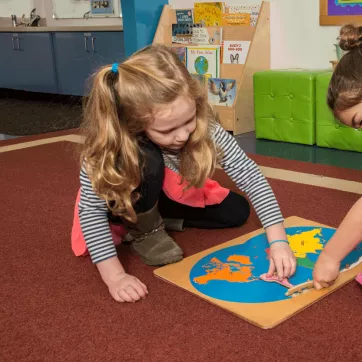 Two elementary school students participate in the after school childcare program at Kennett Area YMCA.