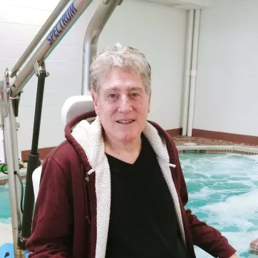 Brandywine YMCA member Dennis Shead sits near the indoor therapy pool. 