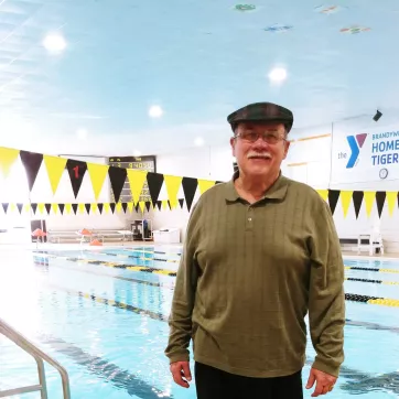 Joseph Amore, a member at Brandywine YMCA stands near the indoor swimming pool in Coatesville, PA