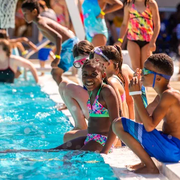 Kids cool off at the Brandywine YMCA outdoor pool at summer camp. 