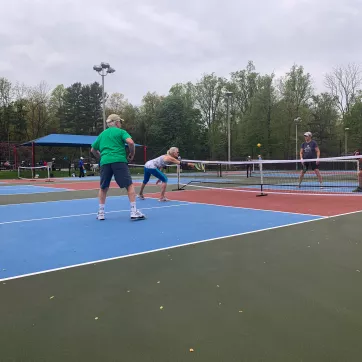 Pickleball players having fun at the Upper Main Line YMCA Pickleball outdoor courts.