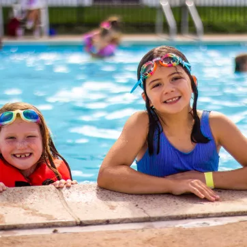 Girls swimming at summer camp 