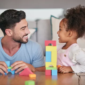 parent and child build with colorful blocks