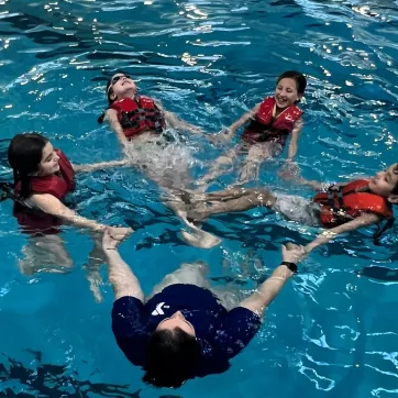 Children in Life Vests Learn Water Safety at the Y