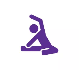 A purple icon of a person sitting on the group stretching.