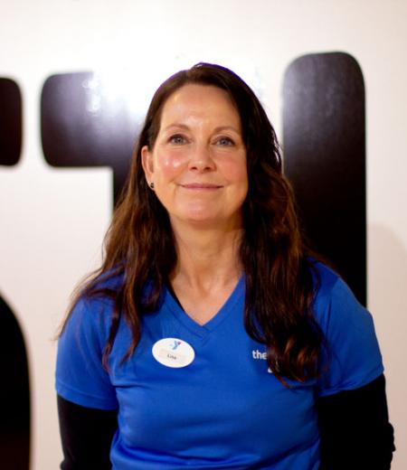 Brandywine YMCA personal trainer Lisa Robidoux poses for her headshot in the virtual group exercise studio in West Chester, PA