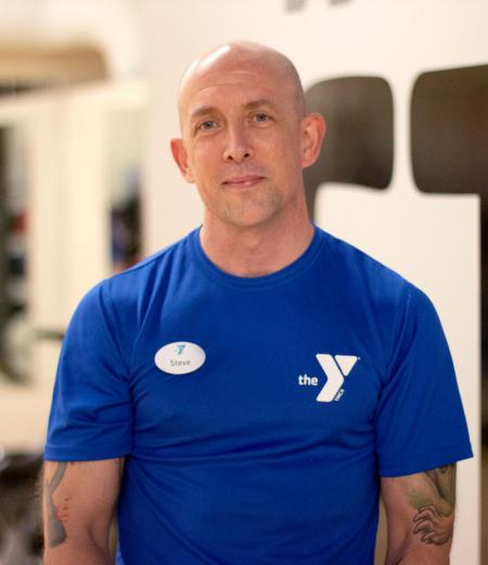 Upper Main Line YMCA personal trainer Steve Fowler poses for a headshot in the gym in Berwyn, PA.
