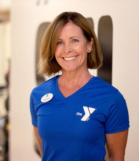 Oscar Lasko YMCA personal trainer Wendy Young poses for her headshot in the YMCA virtual group exercise studio in West Chester, PA.