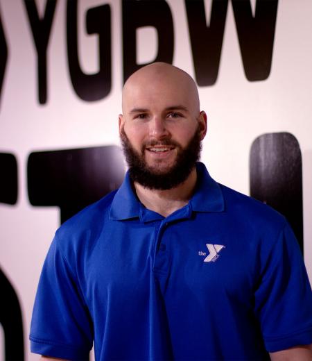 YMCA Personal Trainer Rich Smith poses for a headshot in the YMCA virtual group exercise studio.