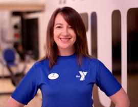 Anna Evans, a personal trainer at West Chester Area YMCA in West Chester poses for a headshot in the gym