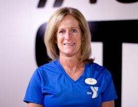 West Chester YMCA personal trainer Cari Wolfe poses in the virtual group exercise studio at the West Chester YMCA.