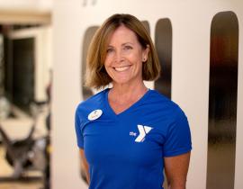 Oscar Lasko YMCA personal trainer Wendy Young poses for her headshot in the YMCA virtual group exercise studio in West Chester, PA.