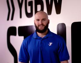 YMCA Personal Trainer Rich Smith poses for a headshot in the YMCA virtual group exercise studio.