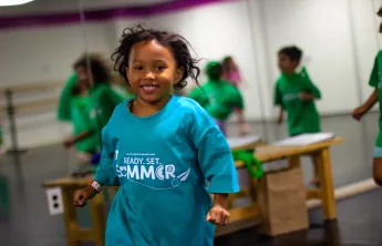 A young girl participates in a dance class during YMCA summer camp at the Upper Main Line YMCA in Berwyn, PA