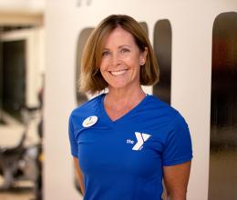 Oscar Lasko YMCA personal trainer Wendy Young poses for a headshot in the virtual group exercise studio. 