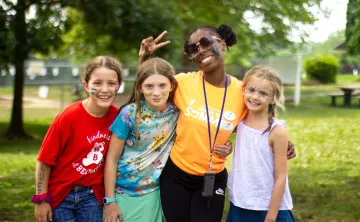 Summer camp counselor with campers at the Coatesville YMCA.